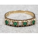 Ladies 9ct yellow gold emerald & diamond band, comprising of 3 round Brilliant cut diamonds and 4