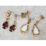 2 pairs of 9ct yellow gold drop earrings including 1 with opal drops & 1 with garnet drops, 1.4g
