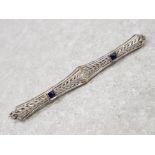 White gold art deco brooch set with 2 sapphires and centre diamond