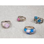4x silver rings . 1x blue topaz + cubic zirconia cluster ring . 1x pink opal + cubic zirconia