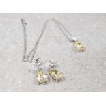 Ladies 9ct white gold earrings and pendant set, comprising of a drop earrings set with yellow pear