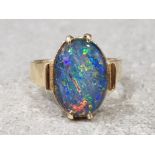 Ladies 9ct yellow gold blue opal ring, comprising of a oval shaped blue opal set in a claw
