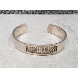 Silver torque style bangle with beaded centre . 46.1g