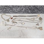 Bag of assorted silver items including pendants and chains, bracelet, ingots, charms etc