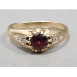 Gents 9ct yellow gold red stone & diamond ring, featuring a round cut red stone in the centre with a