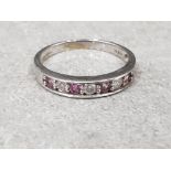 Ladies 9ct white gold pink stone + diamond band , featuring four round pink stones set with round