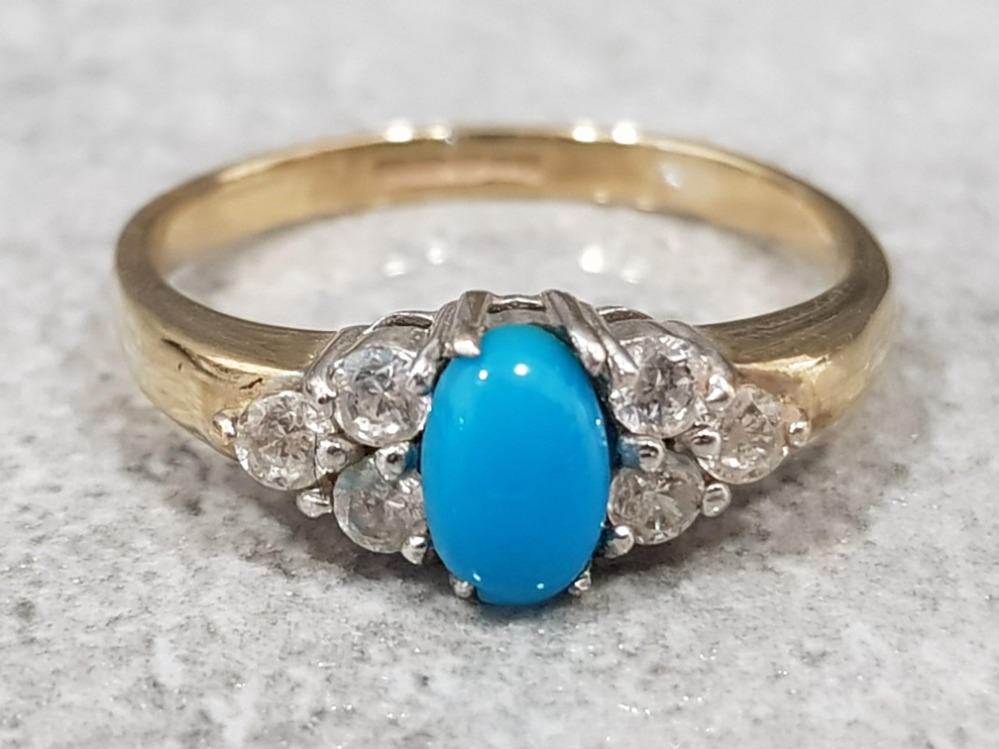 Ladies 9ct yellow gold turquoise & cubic zirconia ring, featuring a oval turquoise in the centre