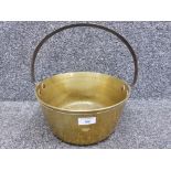 An antique small brass jam of good quality 26.5cm diameter.