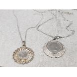 2 silver plated coin pendants on chains