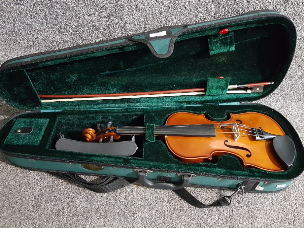 A student's violin by Stentor Music Company Ltd, with spare bow, in fitted case.