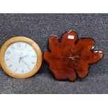 Two modern wall clocks, one made out of a section of tree trunk 43cm wide.