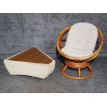 A swivel conservatory chair and a lidded storage unit.