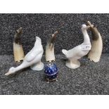 Three carved horn sculptures of penguins, two Nao Geese and a table clock in egg case.