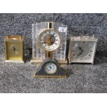 Three modern mantle clocks and a brass carriage clock.