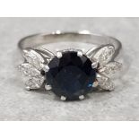 Platinum sapphire & diamond ring, comprising large central sapphire and 3 row diamonds, size P, 4.9g