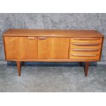 A Younger teak sideboard, two cupboard doors and four drawers 166 x 79 x 45cm.