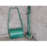 A garden roller and an electric garden tool.