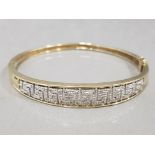 Ladies 9ct yellow gold ornate diamond bangle, set with round brilliant cut diamonds across the top