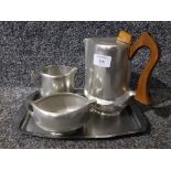 A three piece Picquot Ware tea set with associated tray.