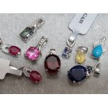 9 silver 925 pendants, a variety of different coloured stones
