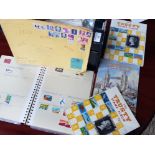 Box of mixed postage stamps from around the world, includes several albums
