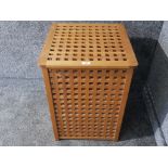 A large wooden laundry basket.