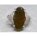 Silver ring set with oval green stone with CZ set shoulders, size P½, 5.5g