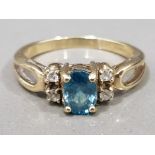 Ladies 9ct yellow gold blue topaz & cubic zirconia ring, comprising of a oval blue topaz set in