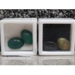 A pair of agate cabochons carved with scarab beetles together with a pair of unakite cabochons