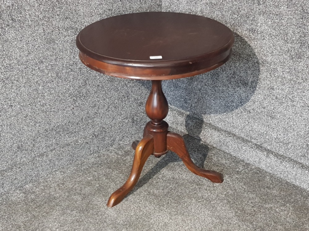 A mahogany circular tripod occasional table 59cm diameter.