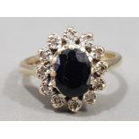 Ladies 9ct yellow gold sapphire & diamond cluster ring, featuring a black sapphire set in the