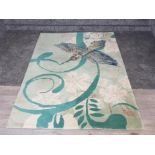 A wool rug with kingfisher pattern 182 x 122cm