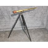 Antique telescopic brass telescope on tripod stand