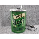 Classic soup kettle in green "hot soup of the day" to front with ladel