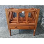 A modern teak Canterbury with single drawer.