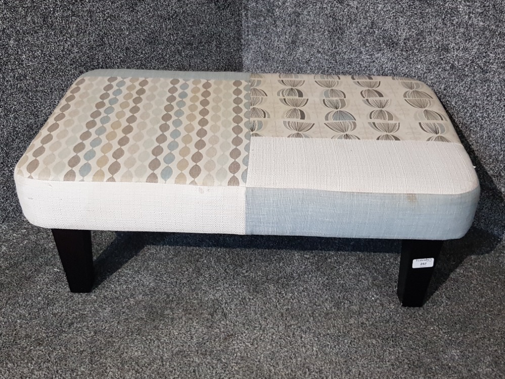 A rectangular footstool raised on square tapering legs 82cm.