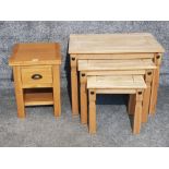 An oak bedside drawer and a nest of tables.
