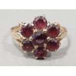 Ladies 9ct yellow gold garnet cluster ring, comprising of seven garnets all the stones are claw set,