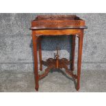 A mahogany Chippendale style silver or centre table with pierced gallery and stretchers 50 x 72cm.