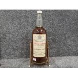 Unopened large 1 gallon bottle of John Dewar & Sons White label whisky, on original Dewars stand,