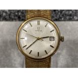 Omega gents 9ct gold watch. Featuring cream dial and gold batons with date display. 9ct gold