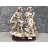 Giuseppe Armani Florance group depicting a courting couple, stamped and signed 32cm high.