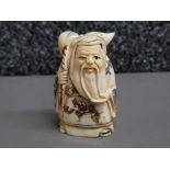 Hand carved bone netsuke, carved as an elder with staff