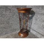 A wood and metal Regency style umbrella stand 57cm high.