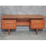 A teak G-Plan dressing table 152 x 70 x 45.5cm