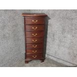 A reproduction mahogany chest of narrow drawers 51 x 119 x 34.5cm.