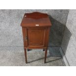 An edwardian mahogany pot cupboard with brass handle.