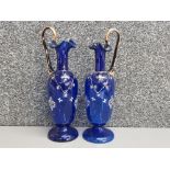 A pair of handmade blue glass italian ewers, heavily hand enamelled & gilded