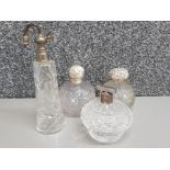 4 antique hand cut & etched perfume bottles some with silver mounts which are slightly damaged