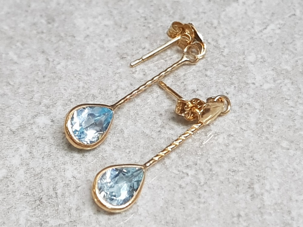 Pair of 9ct yellow gold blue topaz earrings, 0.79g